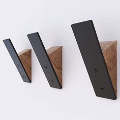 Organize your entryway with this stylish set of three handcrafted coat racks. Made from a combination of steel and oak or beech wood, these versatile pieces offer both functionality and aesthetic appeal.