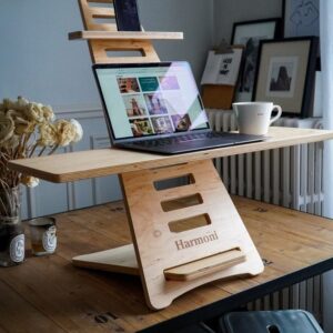 Enhance your work environment with this meticulously crafted plywood laptop stand. Handmade to perfection, it combines practicality with elegance, offering a stylish solution for ergonomic laptop usage.