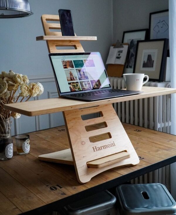 Enhance your work environment with this meticulously crafted plywood laptop stand. Handmade to perfection, it combines practicality with elegance, offering a stylish solution for ergonomic laptop usage.